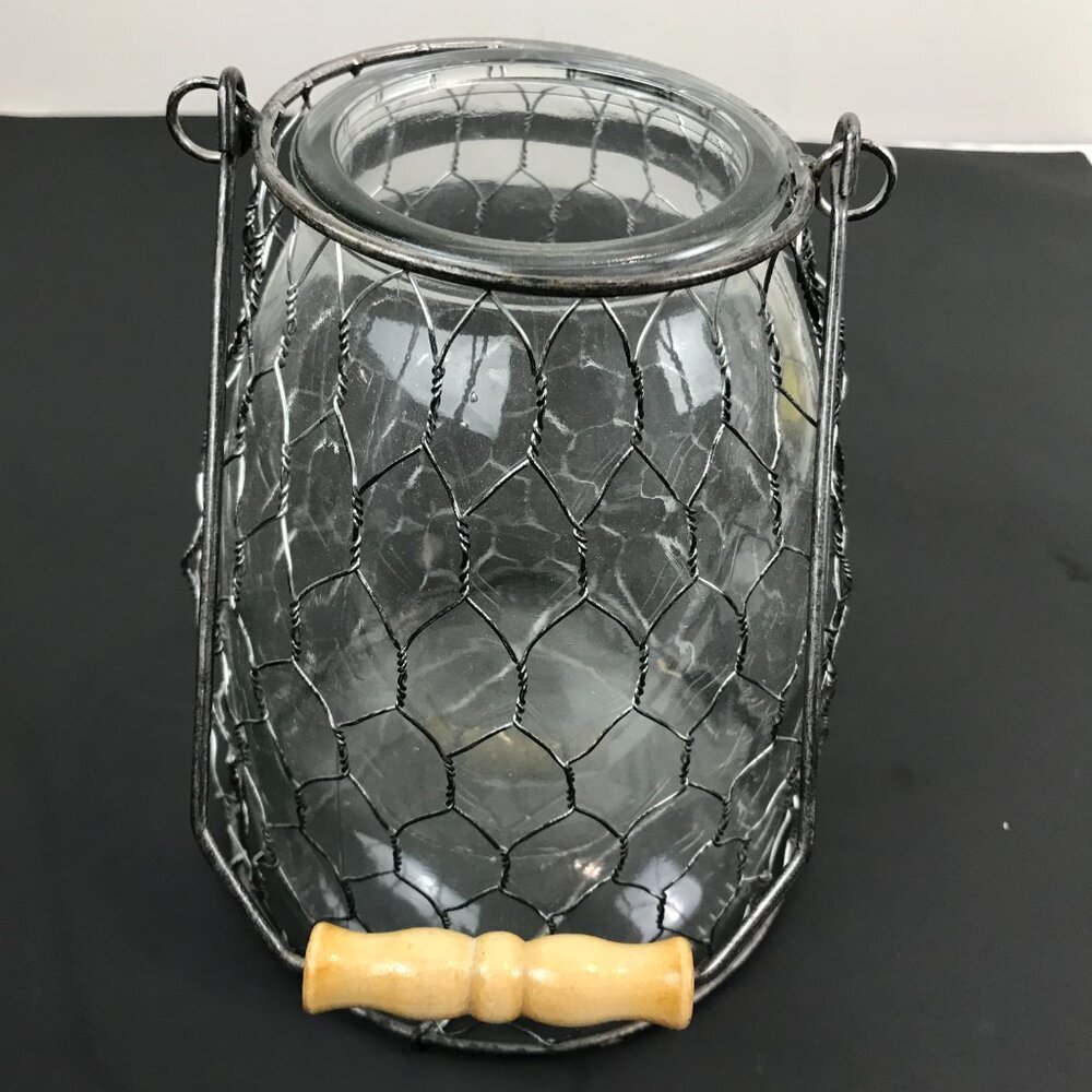 Glass Jar encased in chicken wire w/wood handle Size 7" x 6"